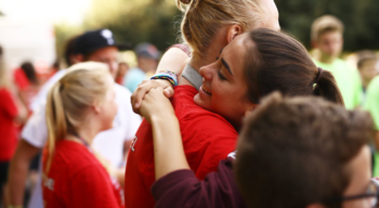 Campers hugging.