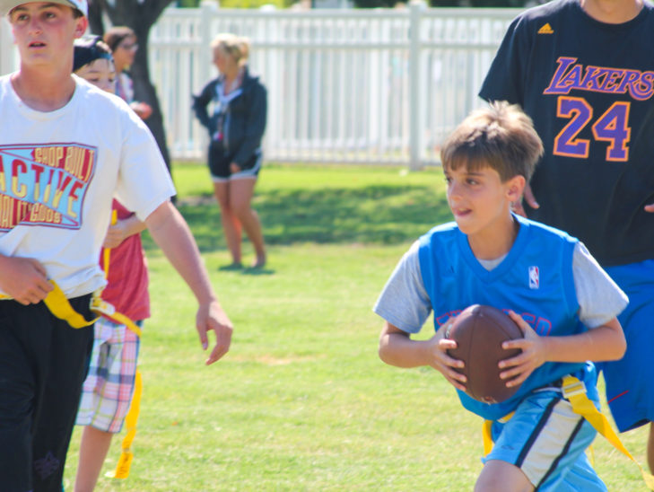 Campers playing flag football.