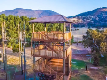 An aerial view of the ropes course on the River Way campus.