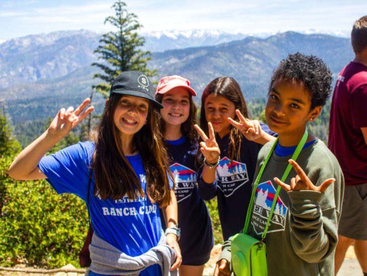 Campers posing for the camera in front of the Sequoia National Forest