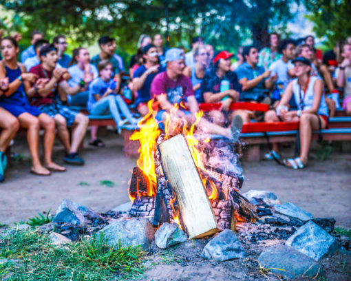 A camp fire at a camp gathering.